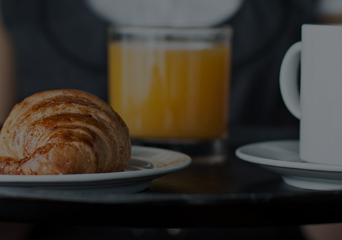 Croissant, Orange Juice and Coffee Cup