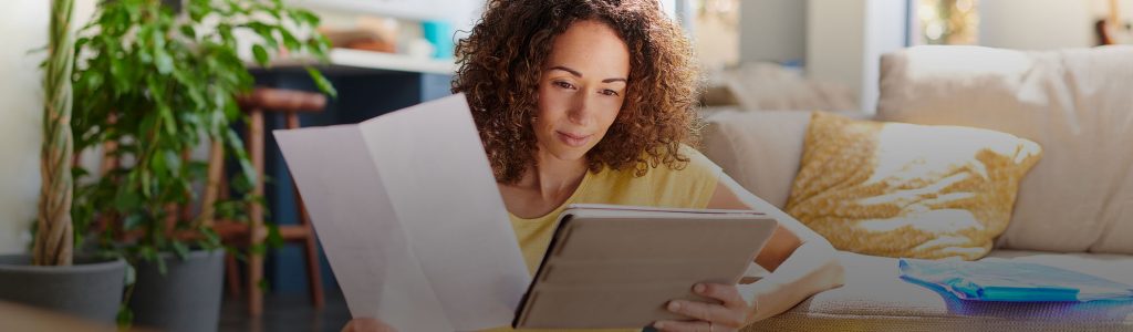 Person Researching Information on Tablet