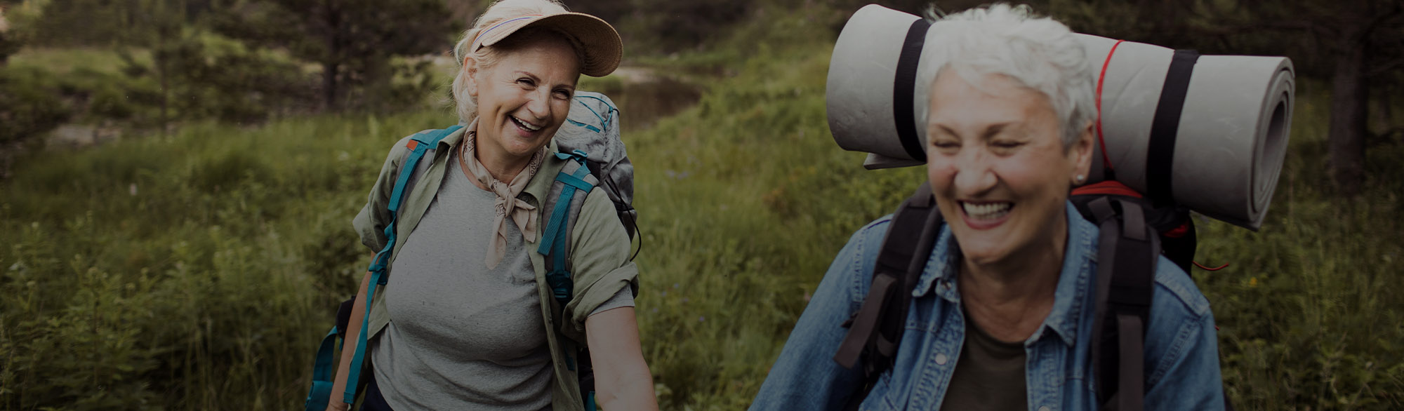 Two People Hiking and Holding Hands