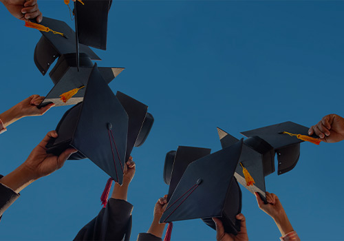 Graduation Caps Thrown in Air