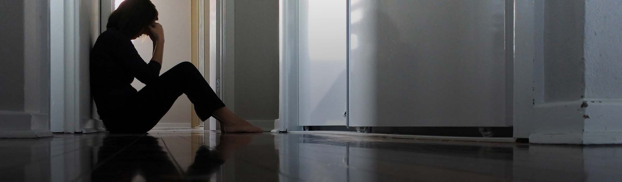 Person Sitting on Floor