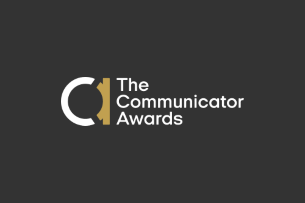 The Communicator Awards logo over a dark background