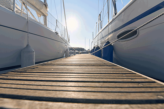 marina with anchored boats on left and right