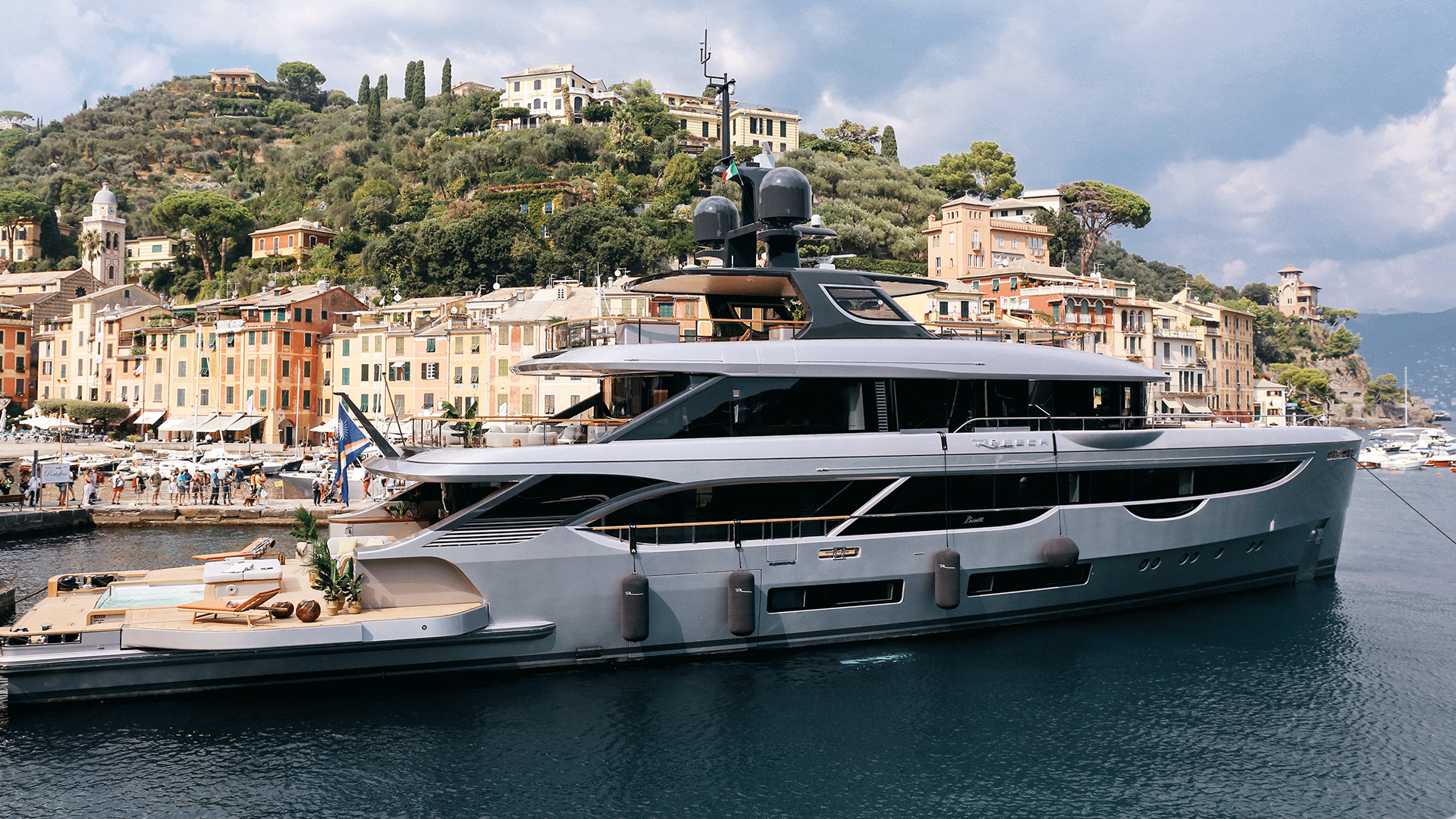 yacht in port near mountain town