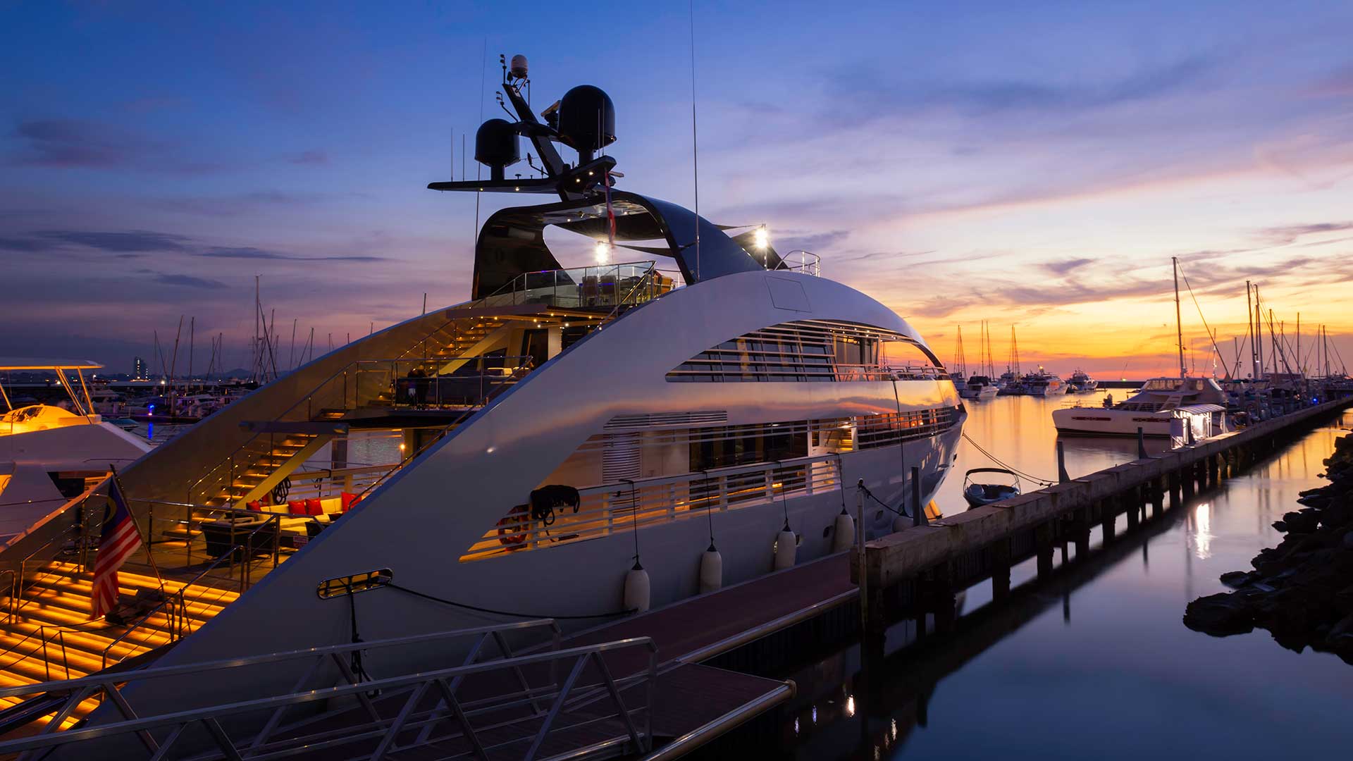 rearview of yacht moored in late sunset