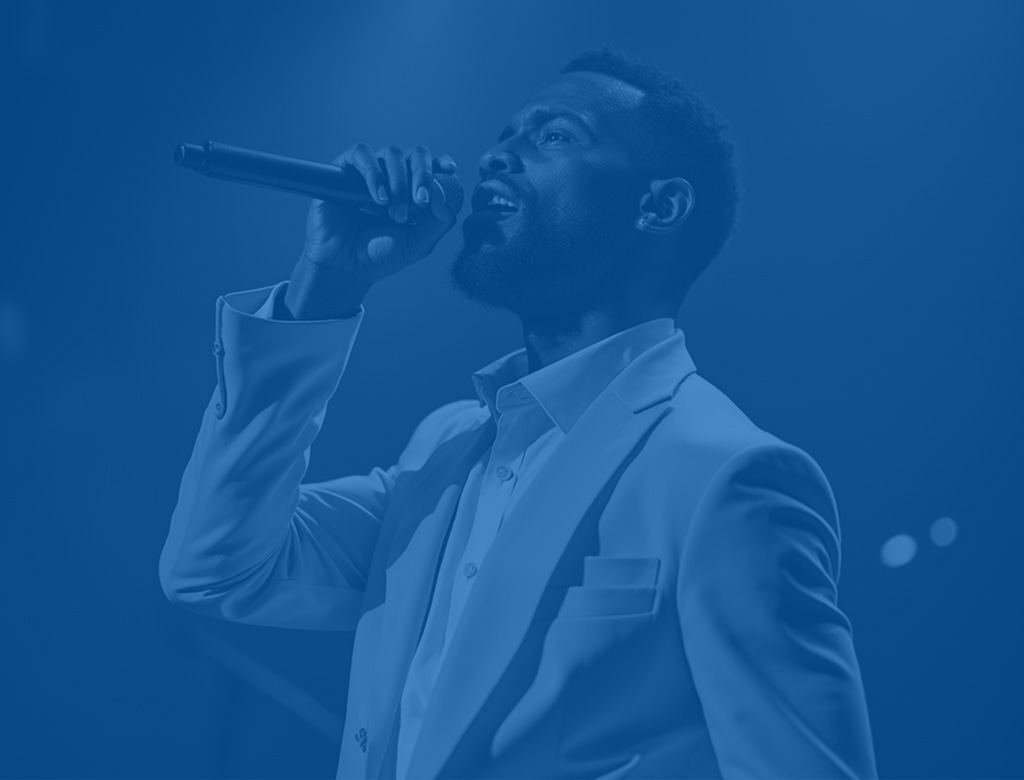 man holding microphone and singing