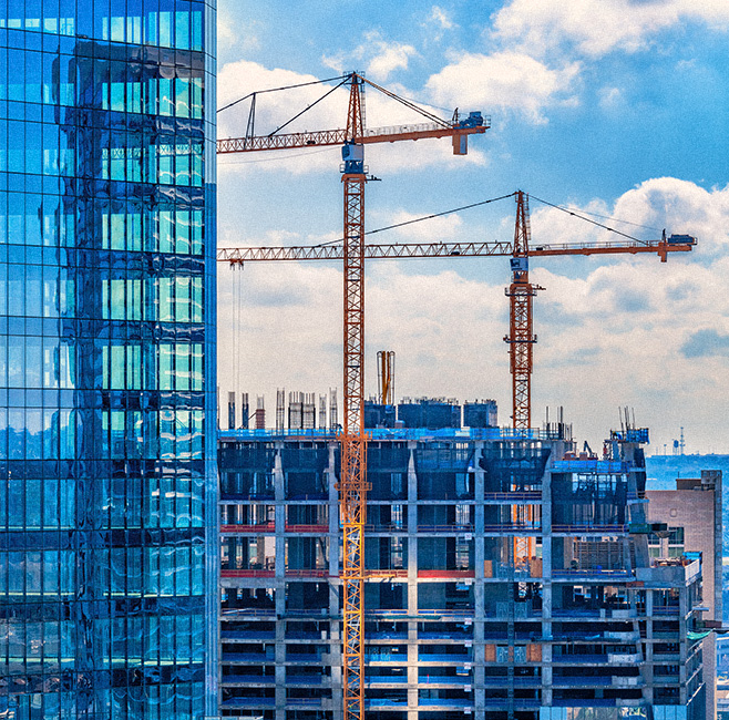 construction cranes and half-finished building