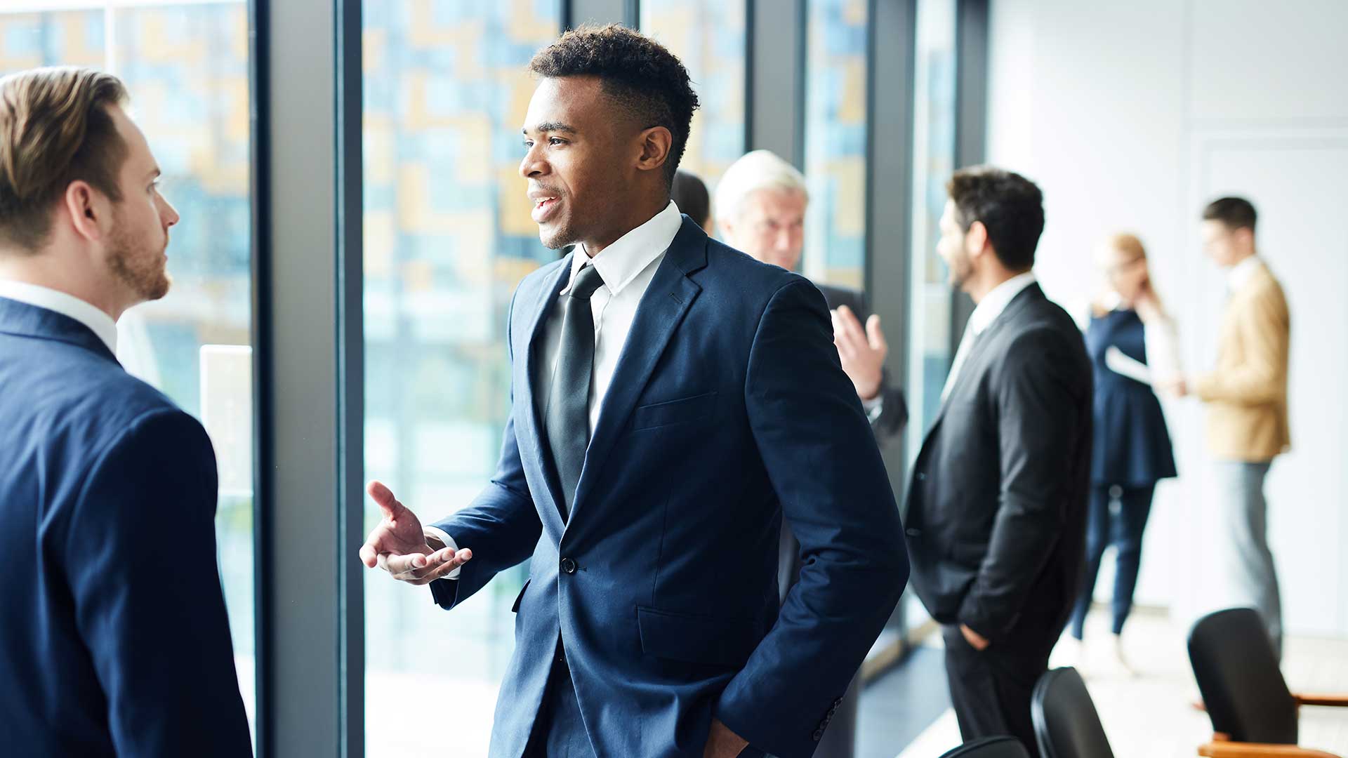 two business men standing and talking